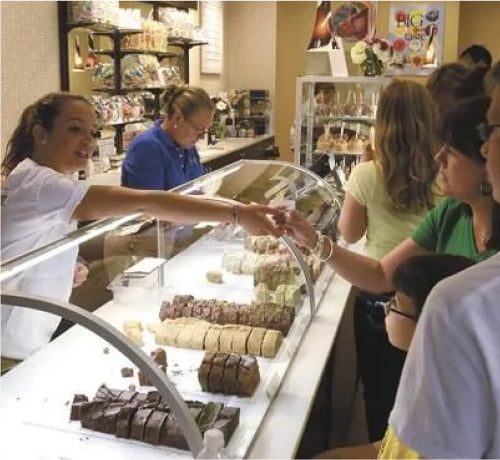 People handing out fudge samples