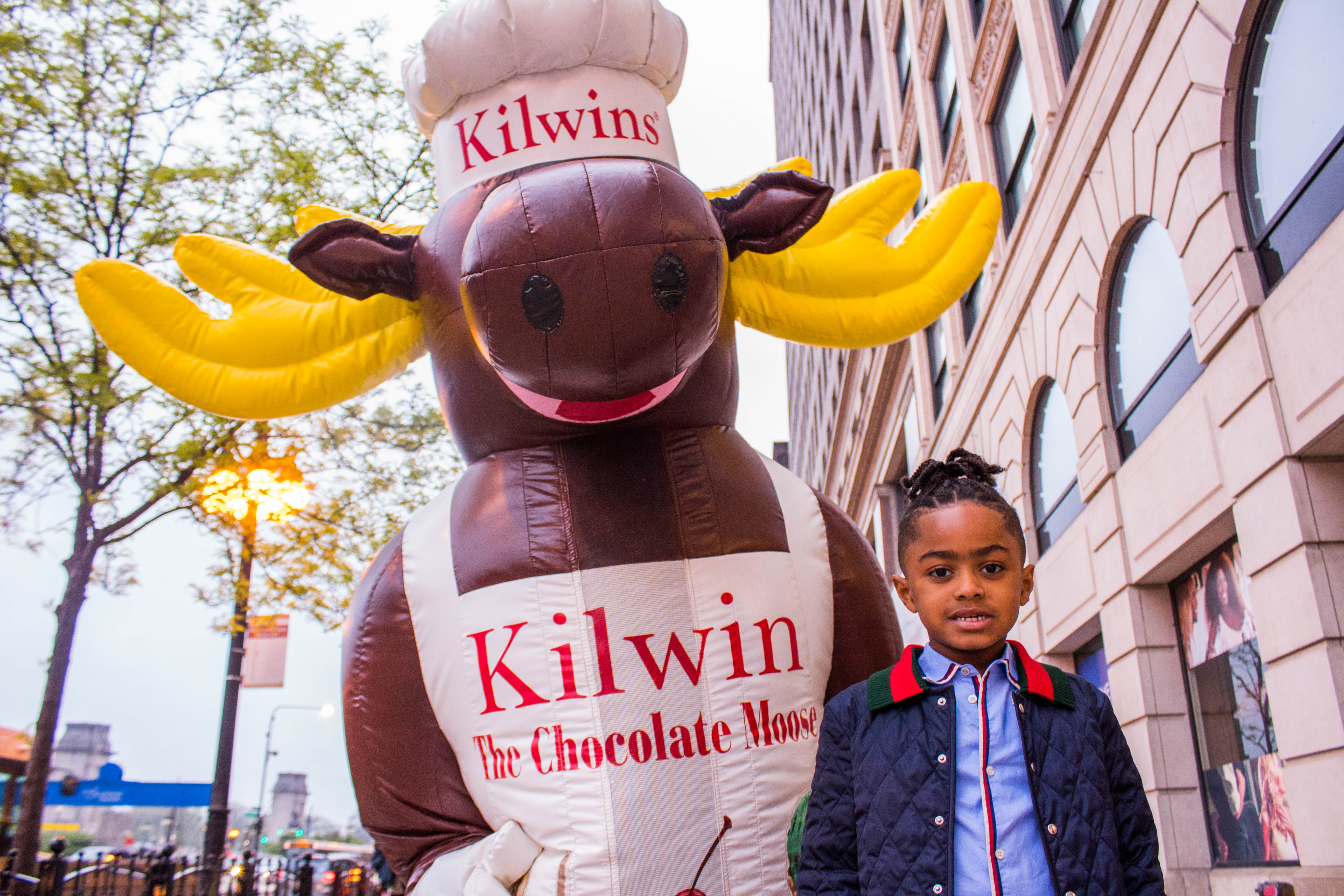 Photo of little girl standing with Kilwins the Moose mascot 
