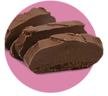 Slices of rich chocolate fudge on pink background