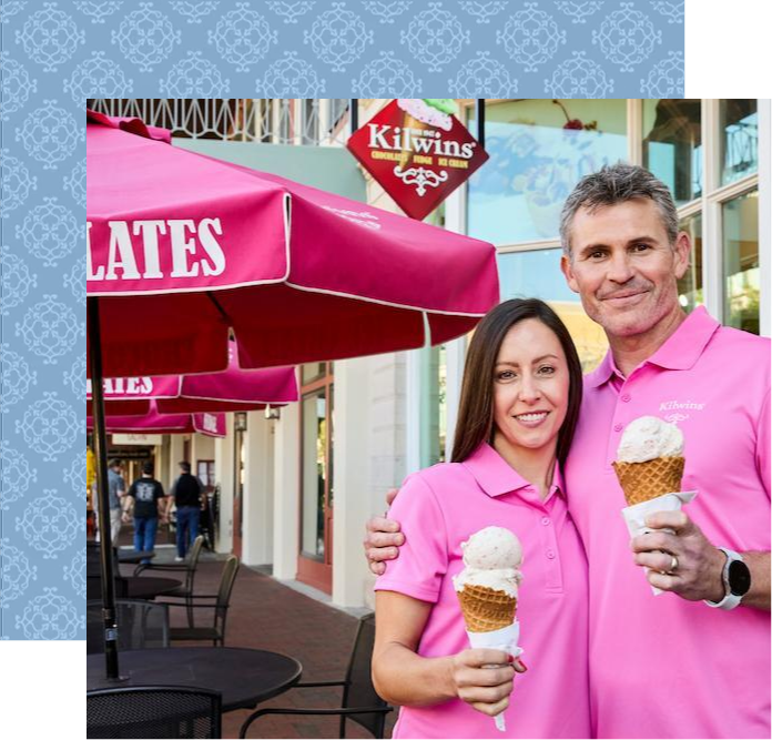 Couple enjoying ice cream outside Kilwins shop
